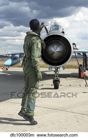 Romanian Air Force pilot checking his MiG-21 Lancer. View Large Photo Image Picture - Romanian Air Force pilot checking his MiG-21 Lancer.. Fotosearch
