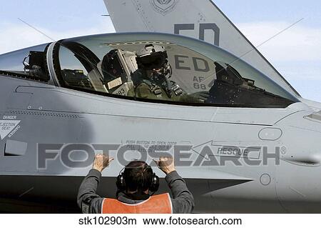round personnel prepares to taxi an F-16 Fighting Falcon. View Large Photo Image Picture - round personnel prepares to taxi an F-16 Fighting Falcon.. Fotosearch