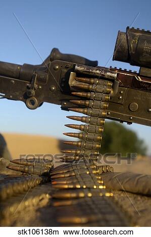 Rounds of a M240 machine gun over a compound roof. View Large Photo Image Picture - Rounds of a M240 machine gun over a compound roof.. Fotosearch