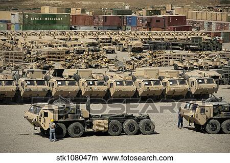 Rows of heavy vehicles and supplies at Camp Warrior, Afghanistan. View Large Photo Image Picture - Rows of heavy vehicles and supplies at Camp Warrior, Afghanistan.. Fotosearch