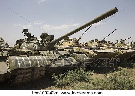 Russian T-54 and T-55 main battle tanks rest in an armor junkyard. View Large Photo Image Picture - Russian T-54 and T-55 main battle tanks rest in an armor junkyard.. Fotosearch