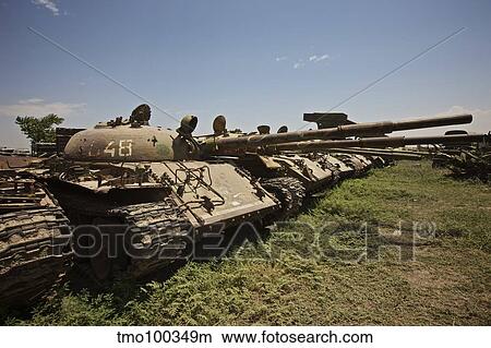 Russian T-62 main battle tanks rest in an armor junkyard. View Large Photo Image Picture - Russian T-62 main battle tanks rest in an armor junkyard.. Fotosearch