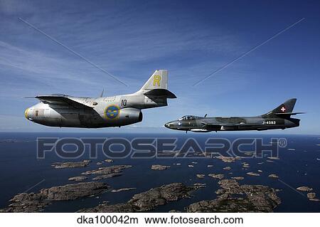 Saab J 29 and Hawker Hunter vintage jet fighters of the Swedish Air Force Historic Flight. View Large Photo Image Picture - Saab J 29 and Hawker Hunter vintage jet fighters of the Swedish Air Force Historic Flight.. Fotosearch