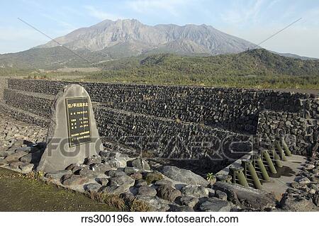 Sabo channel at Haramatsu River with tubular grid dam and Sakurajima volcano, Japan. View Large Photo Image Stock Photograph - Sabo channel at Haramatsu River with tubular grid dam and Sakurajima volcano, Japan.. Fotosearch