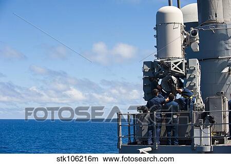 Sailors conduct maintenance on a Close-in Weapon System aboard USS Cowpens View Large Photo Image Picture - Sailors conduct maintenance on a Close-in Weapon System aboard USS Cowpens. Fotosearch