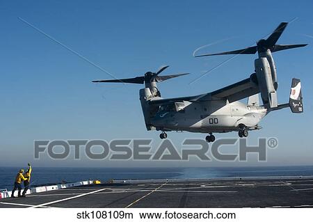 Sailors direct an MV-22 Osprey aboard USS San Diego. View Large Photo Image Picture - Sailors direct an MV-22 Osprey aboard USS San Diego.. Fotosearch