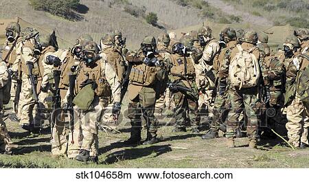 Sailors dressed in full mission oriented protective posture suits. View Large Photo Image Picture - Sailors dressed in full mission oriented protective posture suits.. Fotosearch