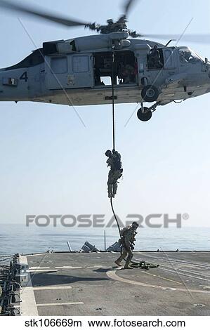 Sailors drop to the flight deck of USS Mobile Bay. View Large Photo Image Picture - Sailors drop to the flight deck of USS Mobile Bay.. Fotosearch