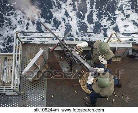 Sailors fire a. 50-caliber machine gun. View Large Photo Image Picture - Sailors fire a. 50-caliber machine gun.. Fotosearch