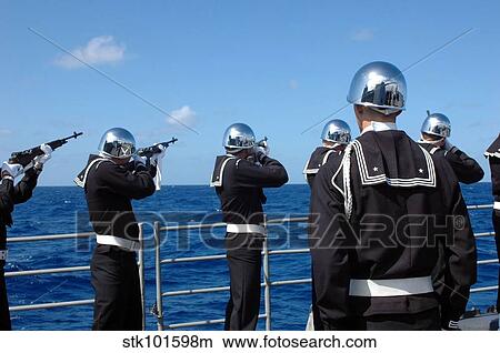 Sailors fire a gun salute during a burial-at-sea. View Large Photo Image Picture - Sailors fire a gun salute during a burial-at-sea.. Fotosearch