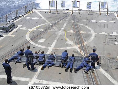 Picture - Sailors fire M4A1 carbine assault rifles aboard USS Halsey.. Fotosearch