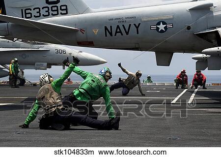 Sailors give launch approval for an EA-6B Prowler aboard USS John C. Stennis. View Large Photo Image Picture - Sailors give launch approval for an EA-6B Prowler aboard USS John C. Stennis.. Fotosearch