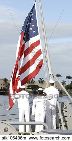 Sailors hoist the American flag for morning colors aboard the Battleship Missouri. View Large Photo Image Picture - Sailors hoist the American flag for morning colors aboard the Battleship Missouri.. Fotosearch