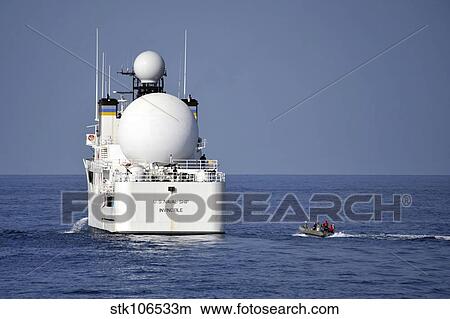 Sailors in a rigid-hull inflatable approach USNS Invincible. View Large Photo Image Picture - Sailors in a rigid-hull inflatable approach USNS Invincible.. Fotosearch