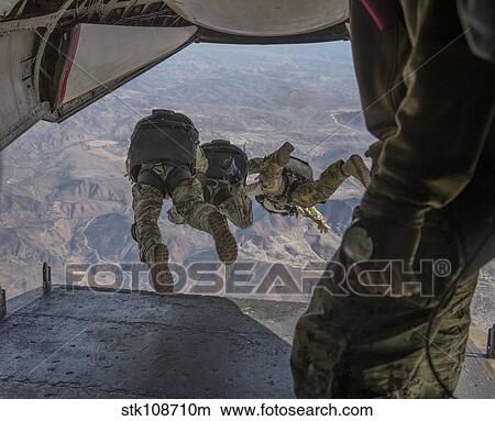 Sailors jump out of a C2-A Greyhound. View Large Photo Image Picture - Sailors jump out of a C2-A Greyhound.. Fotosearch