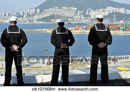 Sailors man the rails aboard the aircraft carrier USS Nimitz. View Large Photo Image Picture - Sailors man the rails aboard the aircraft carrier USS Nimitz.. Fotosearch
