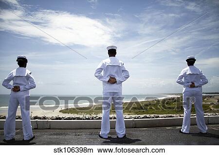 Sailors man the rails as the ship pulls into Naval Station Norfolk. View Large Photo Image Picture - Sailors man the rails as the ship pulls into Naval Station Norfolk.. Fotosearch