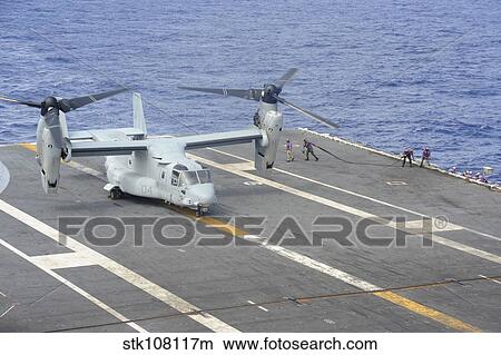 Sailors move into position to refuel a MV-22 Osprey. View Large Photo Image Picture - Sailors move into position to refuel a MV-22 Osprey.. Fotosearch