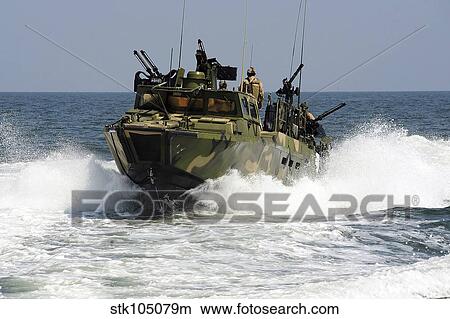 Sailors navigate the waters in a riverine command boat. View Large Photo Image Picture - Sailors navigate the waters in a riverine command boat.. Fotosearch