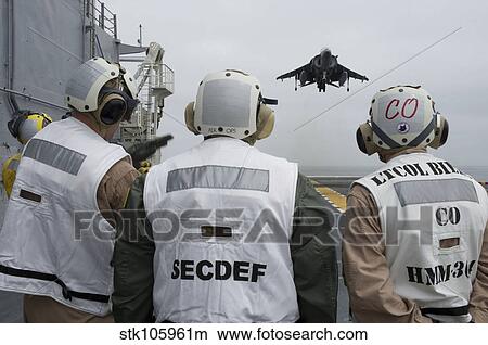 Picture - Sailors observe an aircraft on board USS Peleliu.. Fotosearch