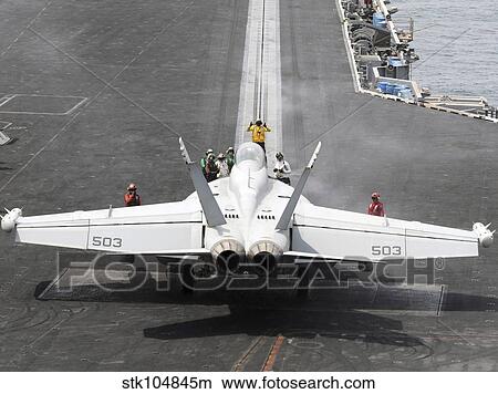 Sailors perform pre-launch checks on an EA-18G Growler. View Large Photo Image Picture - Sailors perform pre-launch checks on an EA-18G Growler.. Fotosearch
