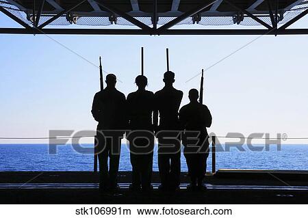 Sailors practice color guard drills aboard USS Kearsarge. View Large Photo Image Picture - Sailors practice color guard drills aboard USS Kearsarge.. Fotosearch