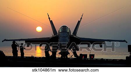 Sailors prepare an F/A-18C Hornet for flight operations aboard USS John C. Stennis. View Large Photo Image Picture - Sailors prepare an F/A-18C Hornet for flight operations aboard USS John C. Stennis.. Fotosearch