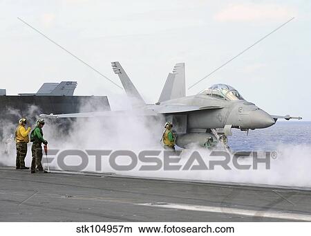 Sailors prepare an F/A-18F Super Hornet for launch aboard USS George Washington. View Large Photo Image Picture - Sailors prepare an F/A-18F Super Hornet for launch aboard USS George Washington.. Fotosearch