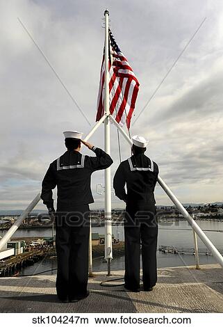 Sailors raise the national ensign aboard USS Abraham Lincoln. View Large Photo Image Picture - Sailors raise the national ensign aboard USS Abraham Lincoln.. Fotosearch
