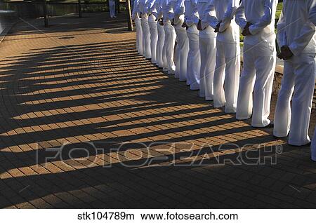 Sailors stand at parade rest during a ceremony. View Large Photo Image Picture - Sailors stand at parade rest during a ceremony.. Fotosearch