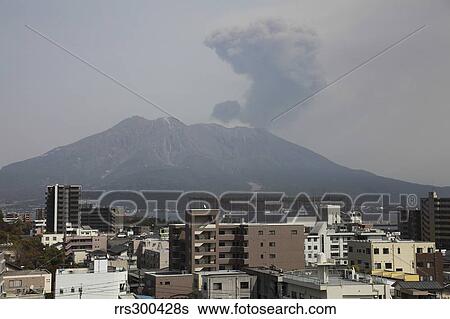 Stock Photograph - Sakurajima volcano as viewed from Kagoshima city, Japan.. Fotosearch