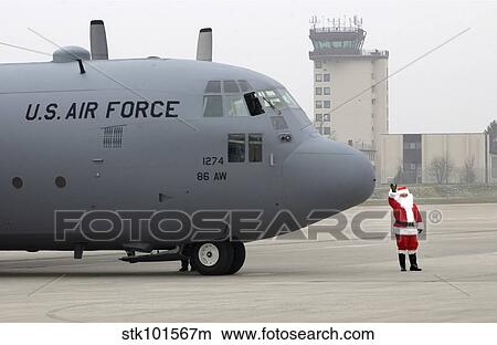 Santa arrives by a C-130 Hercules. View Large Photo Image Picture - Santa arrives by a C-130 Hercules.. Fotosearch