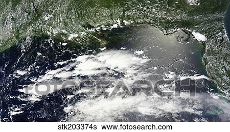 Stock Photograph - Satellite view of oil leaking from the damaged Deepwater Horizon well in the Gulf of Mexico.. Fotosearch
