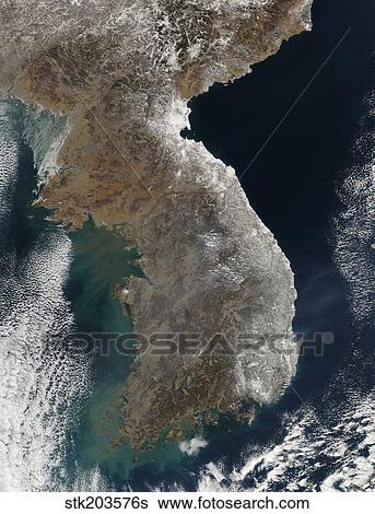 Stock Photograph - Satellite view of snowfall along South Korea's east coast.. Fotosearch