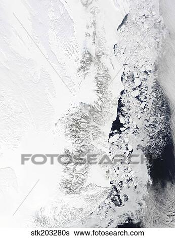 Satellite view of the eastern coast of Greenland. View Large Photo Image Stock Photograph - Satellite view of the eastern coast of Greenland. . Fotosearch
