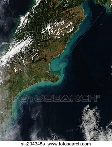 Stock Photograph - Satellite view showing sediment near Christchurch, New Zealand.. Fotosearch