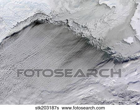 Stock Photograph - Sea ice and cloud streets in the Bering Sea.. Fotosearch