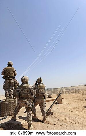 Seabees watch rockets fire overhead. View Large Photo Image Picture - Seabees watch rockets fire overhead.. Fotosearch