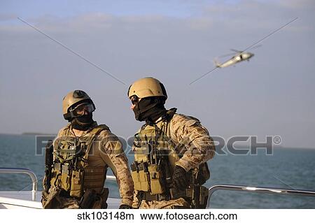 SEALS aboard a rigid-hull inflatable boat. View Large Photo Image Picture - SEALS aboard a rigid-hull inflatable boat. . Fotosearch