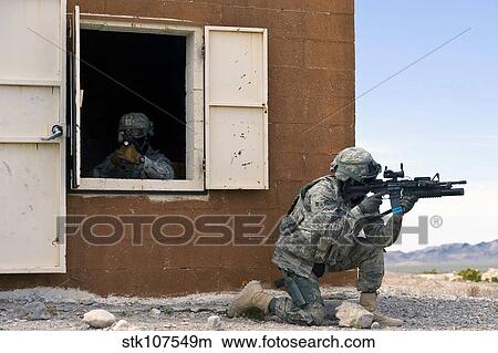 Security forces Airmen guard a building during training. View Large Photo Image Picture - Security forces Airmen guard a building during training.. Fotosearch