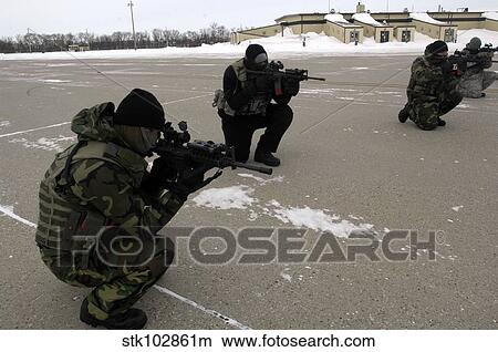 Picture - Security Forces members endure the harsh cold during training.. Fotosearch