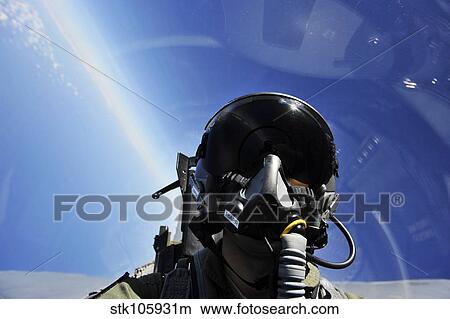 Self-portrait of a pilot in the cockpit of his aircraft during flight. View Large Photo Image Picture - Self-portrait of a pilot in the cockpit of his aircraft during flight.. Fotosearch
