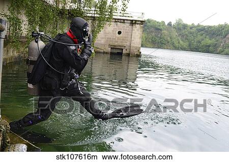 Senior Airman enters the water during rescue dive training. View Large Photo Image Picture - Senior Airman enters the water during rescue dive training.. Fotosearch