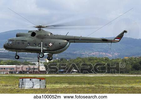 Picture - Serbian Air Force Mi-8 helicopter with bambi bucket.. Fotosearch