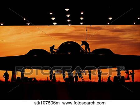 Service members undergo maintenance on a B-2 Spirit. View Large Photo Image Picture - Service members undergo maintenance on a B-2 Spirit.. Fotosearch