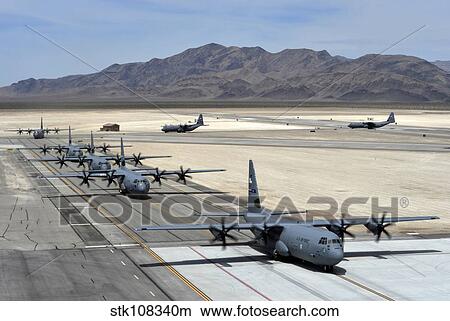 Seven C-130J Super Hercules taxiing at Creech Air Force Base. View Large Photo Image Picture - Seven C-130J Super Hercules taxiing at Creech Air Force Base.. Fotosearch