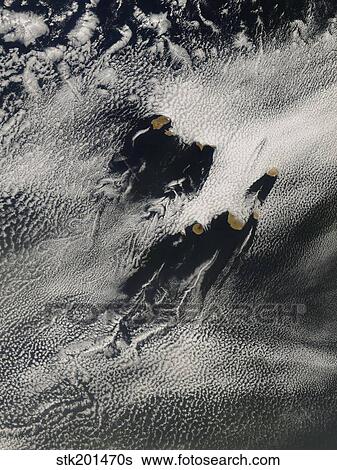 Ship-wave-shaped wave clouds and cloud vortices induced by the Cape Verde Islands. View Large Photo Image Stock Photograph - Ship-wave-shaped wave clouds and cloud vortices induced by the Cape Verde Islands.. Fotosearch
