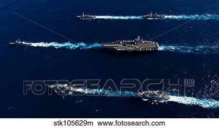 Picture - Ships from the John C. Stennis Carrier Strike Group transit the Pacific Ocean.. Fotosearch