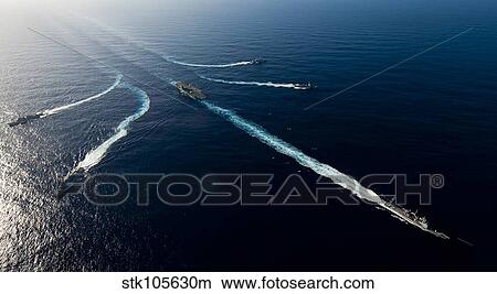 Picture - Ships from the John C. Stennis Carrier Strike Group transit the Pacific Ocean.. Fotosearch