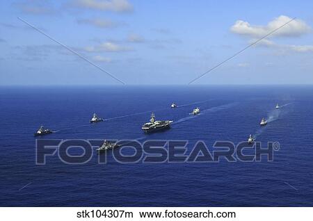 Ships from the Ronald Reagan Carrier Strike Group transit the Pacific Ocean. View Large Photo Image Picture - Ships from the Ronald Reagan Carrier Strike Group transit the Pacific Ocean.. Fotosearch